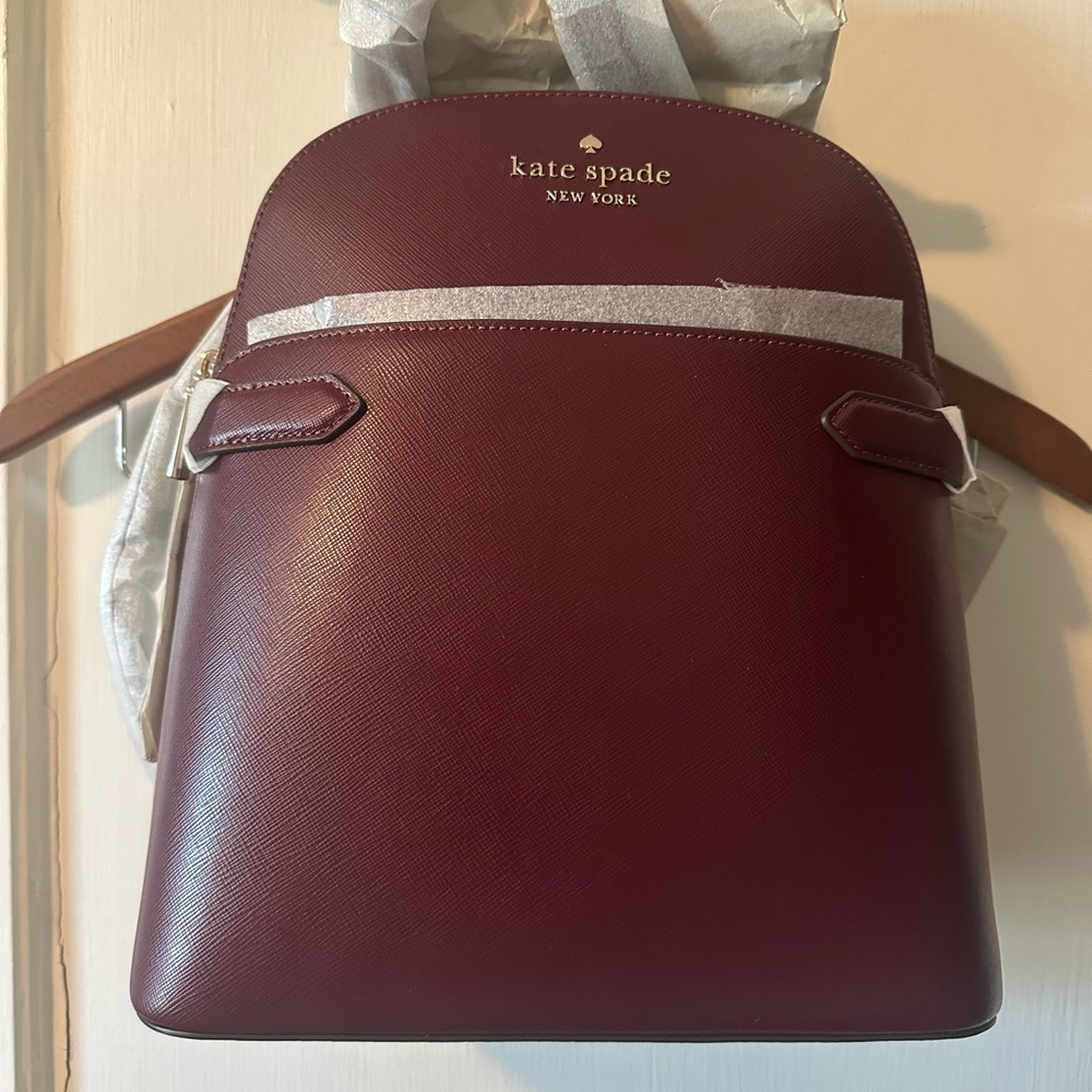 Kate Spade Burgundy Backpack NWT and packaging.